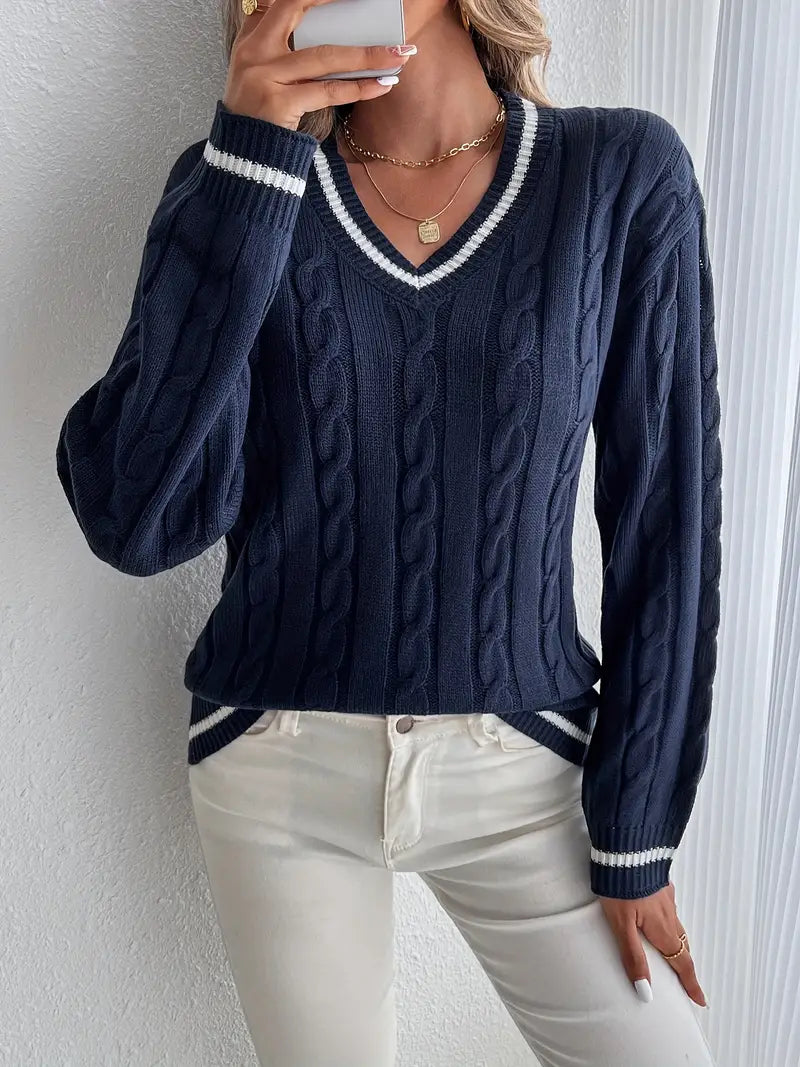 Navy blue women's V-neck cable knit sweater with stylish striped trim. Perfect for fall and winter.