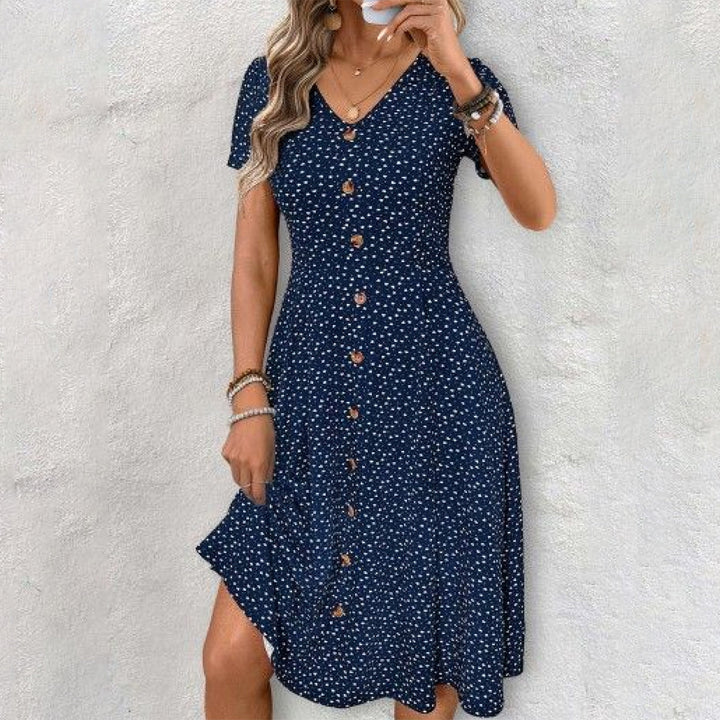 Navy polka dot midi dress with V-neck and short sleeves for women.