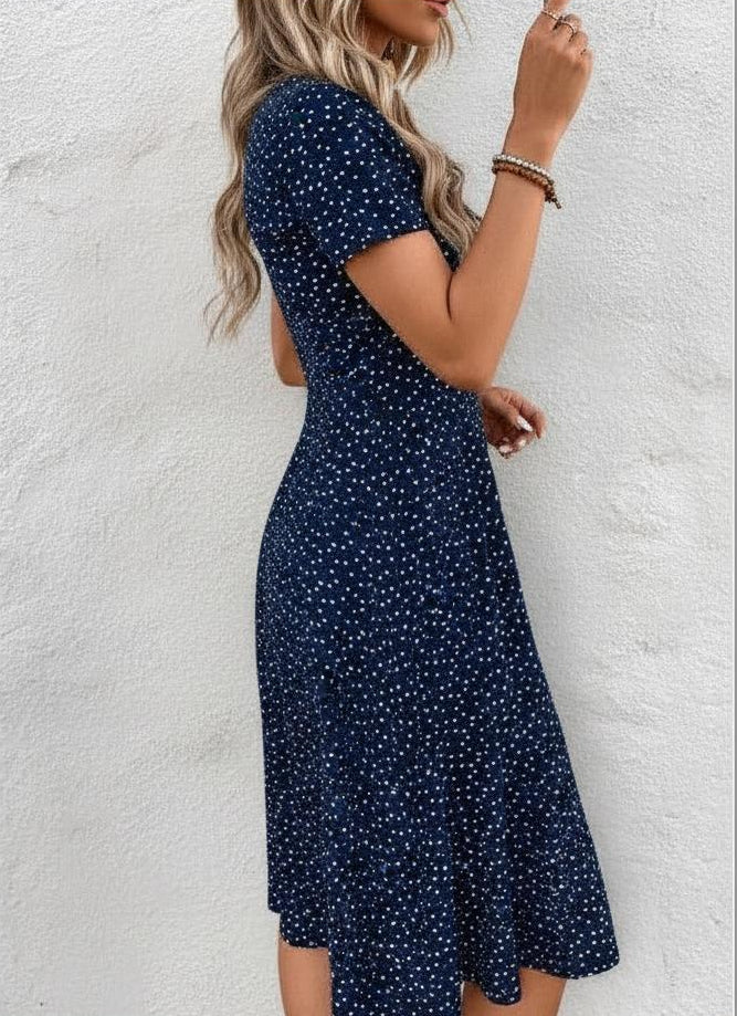Casual short sleeve V-neck midi dress in navy polka dot print.