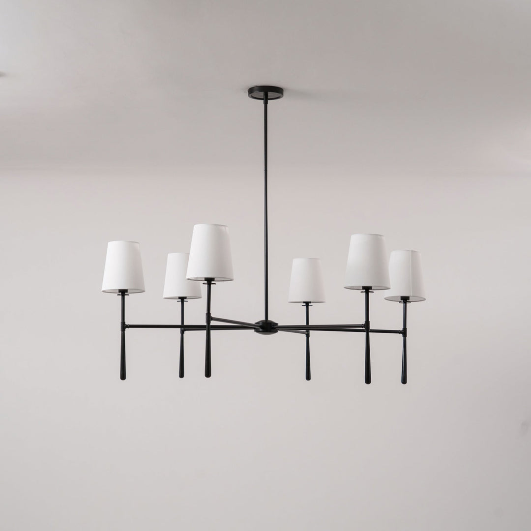 Bedroom Nevell chandelier; elegant brass lighting for a touch of mid-century luxury.