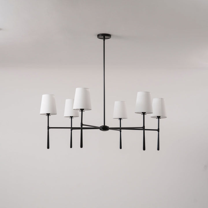 Bedroom Nevell chandelier; elegant brass lighting for a touch of mid-century luxury.