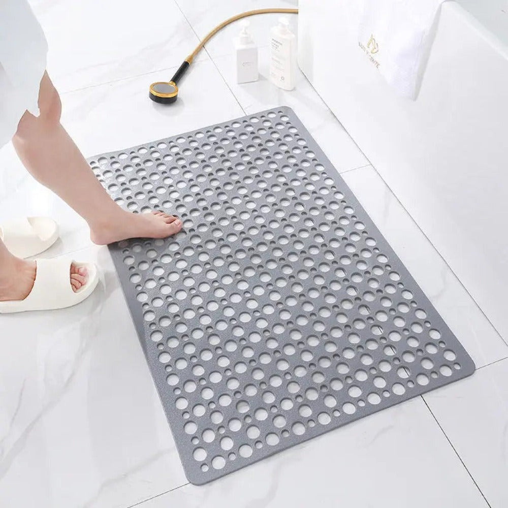 Anti-slip shower mat in use, demonstrating secure footing & ultimate bathroom safety.