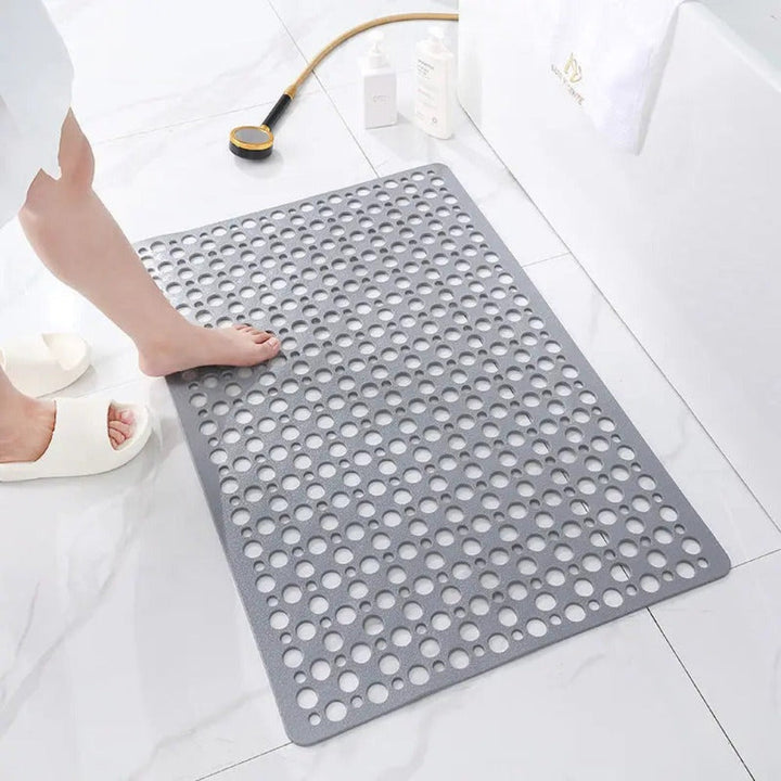 Anti-slip shower mat in use, demonstrating secure footing & ultimate bathroom safety.