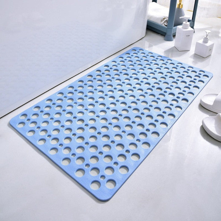 Easy-clean drainage mat for shower safety, featuring strong anti-slip grip. PVC material.