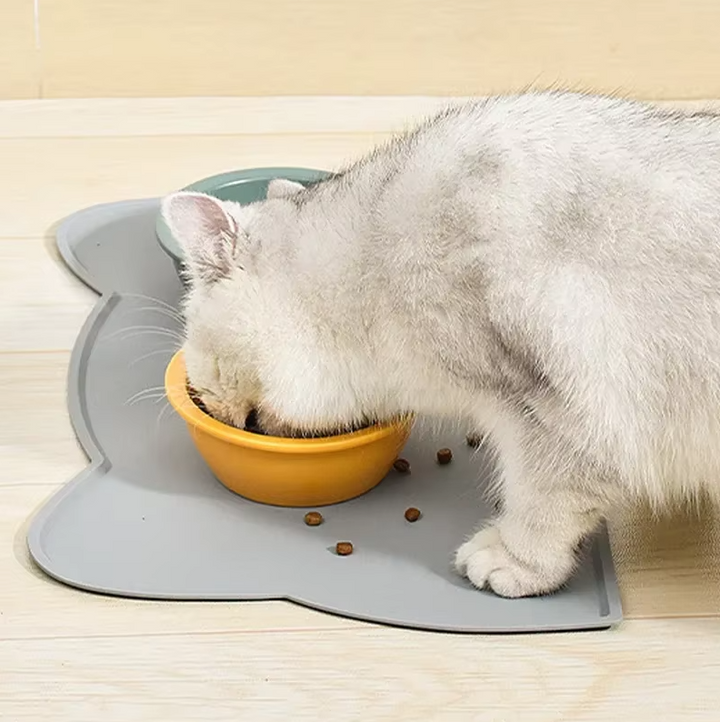 Wipe clean silicone cat feeding mat with non-slip backing for stability during meals.