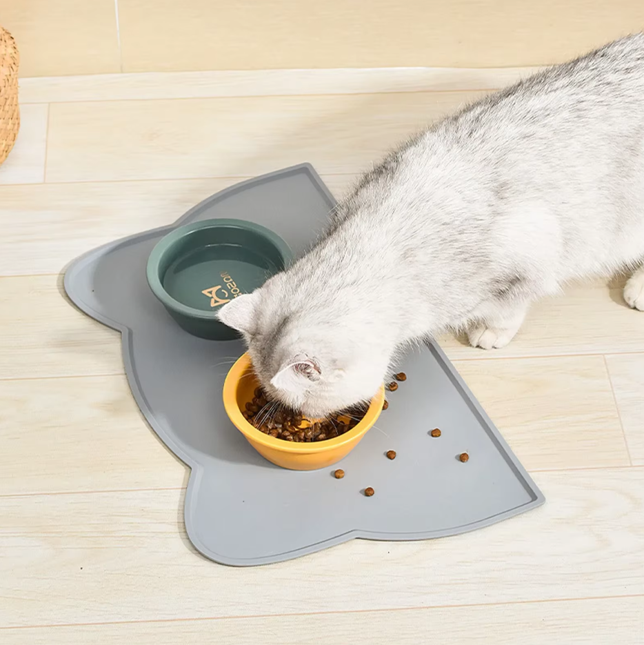 Modern non-slip silicone pet mat designed for cats to prevent spills and keep food contained.