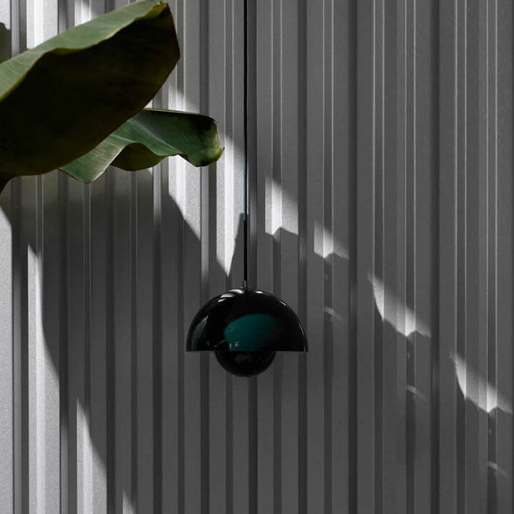 Nordic Dome Pendant Lamp illuminating a modern living room. Stylish Scandinavian ceiling light for home decor.