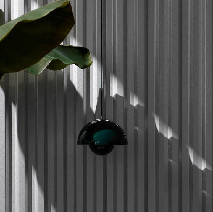 Nordic Dome Pendant Lamp illuminating a modern living room. Stylish Scandinavian ceiling light for home decor.