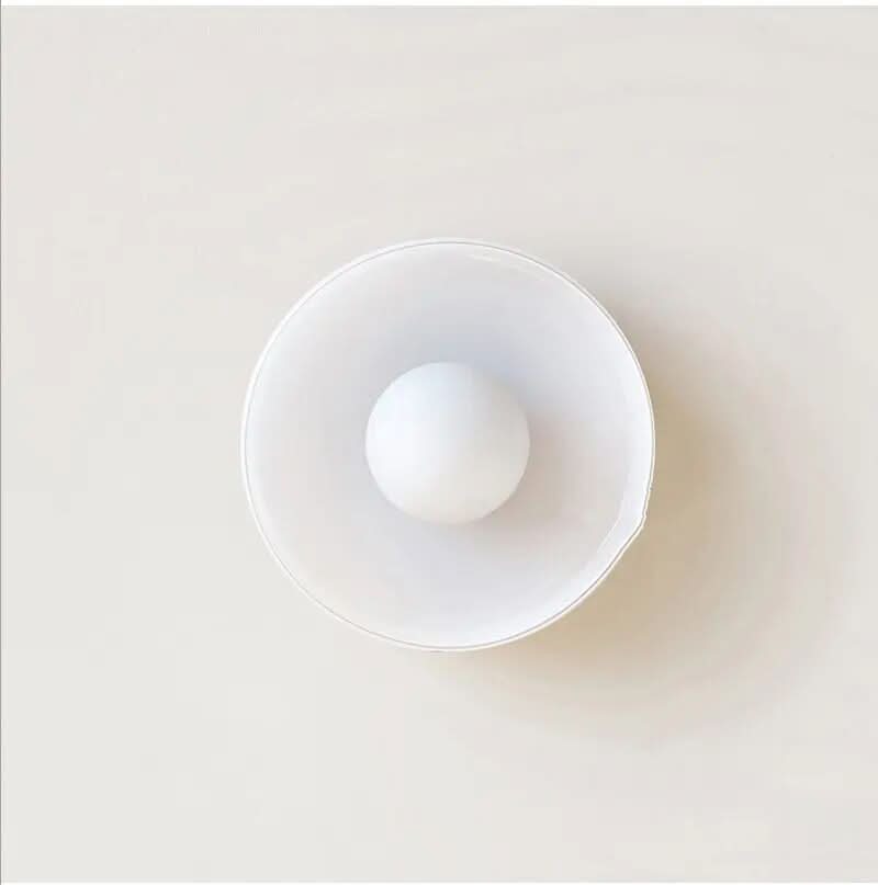 Sleek glass ceiling lamp, a Scandinavian-inspired fixture for stylish and ambient home lighting.