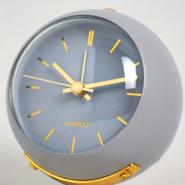 Pink metal desk clock with luminous features and a quiet, Nordic aesthetic