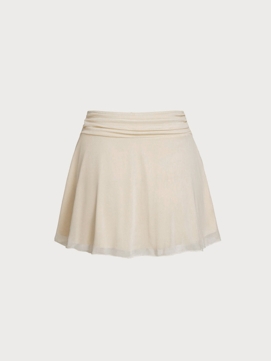 Close-up of sparkling star embellishments on a flowy off-white women's resort wear skirt.