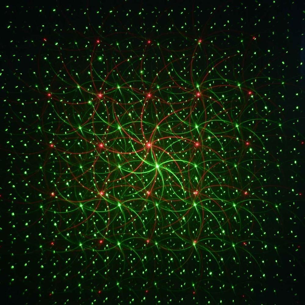 Remote control outdoor Christmas laser light projector, projecting red & green holiday lights on homes.