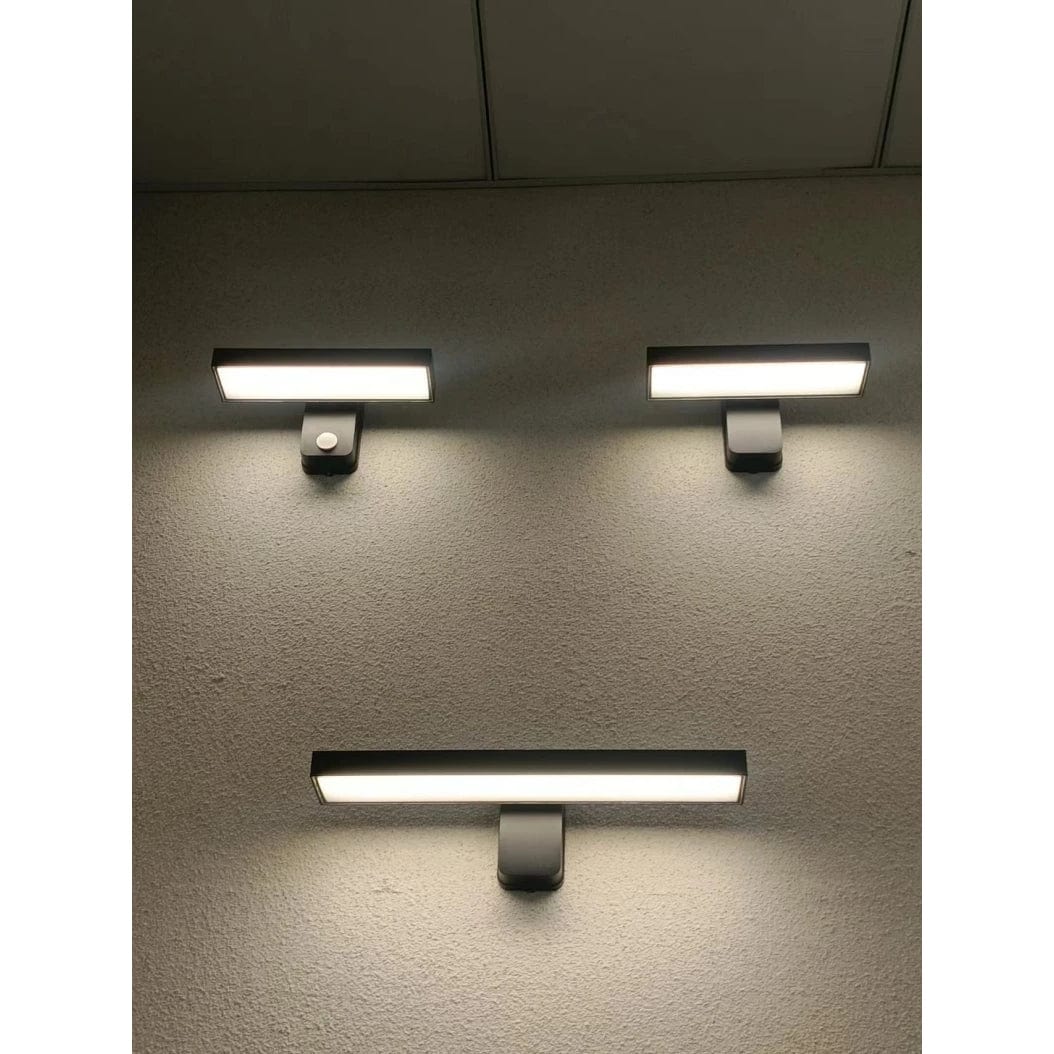 Porch wall light with motion sensor, warm white, adjustable design, weather resistant.