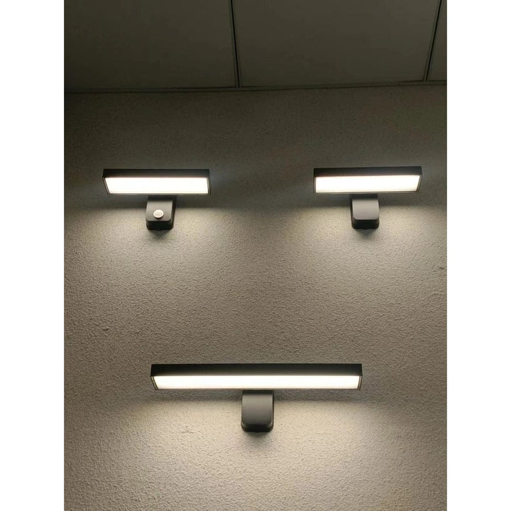 Porch wall light with motion sensor, warm white, adjustable design, weather resistant.