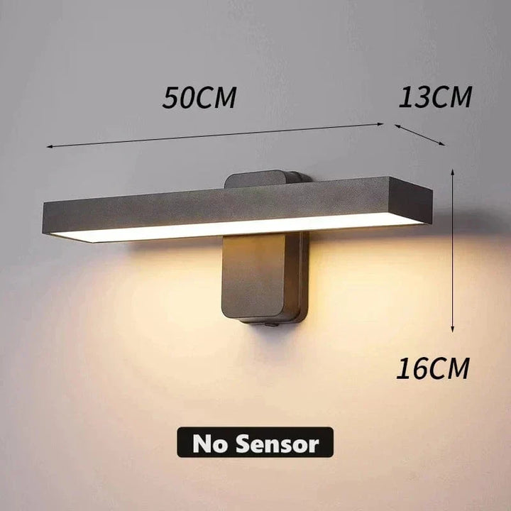 Durable exterior wall lamp, motion sensing, warm white illumination, all-weather.