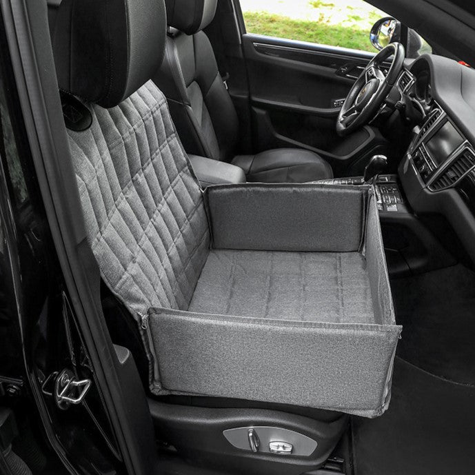 Padded dog car seat & travel basket ensures safe, comfortable rides for small pets. Durable car protector.