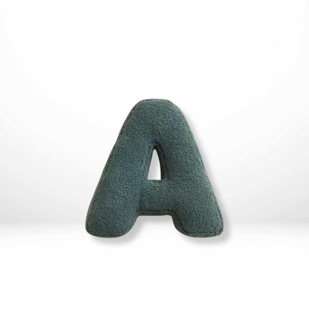 Personalized velvet alphabet cushion, stylish initial home decor pillow for living room.