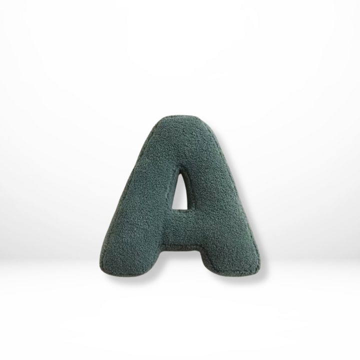 Personalized velvet alphabet cushion, stylish initial home decor pillow for living room.