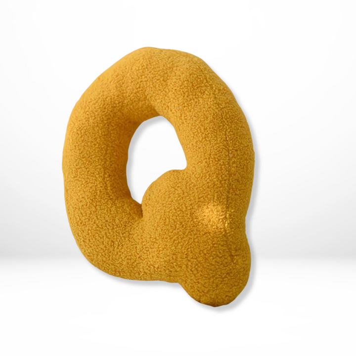 Luxurious velvet alphabet initial pillow, adding custom charm to any interior decor.