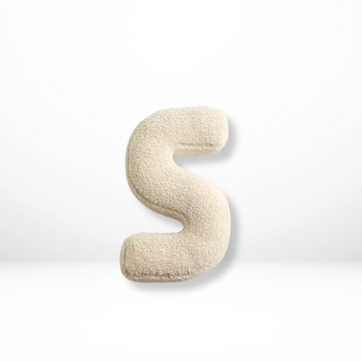 Custom velvet alphabet pillow, enhancing personalized living room or bedroom decor.