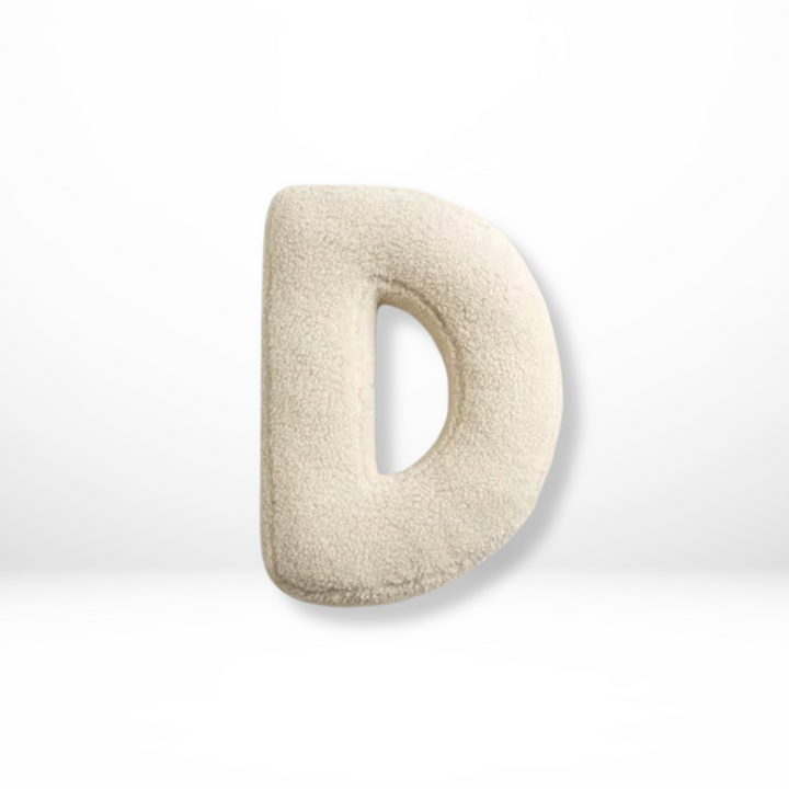 Velvet letter accent pillow, personalized decor for stylish living and bedroom spaces.
