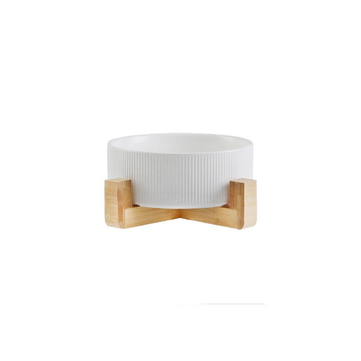Ergonomic elevated pet feeder with two ceramic bowls and a chic wooden base.
