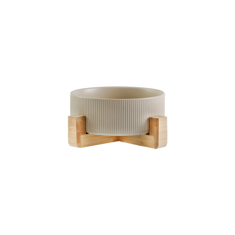 Practical & stylish pet feeding station featuring ceramic bowls & an elegant wooden stand.