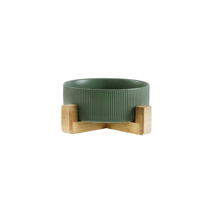 Natural wood pet feeder stand with two clean ceramic bowls for a dog or cat feeding area.