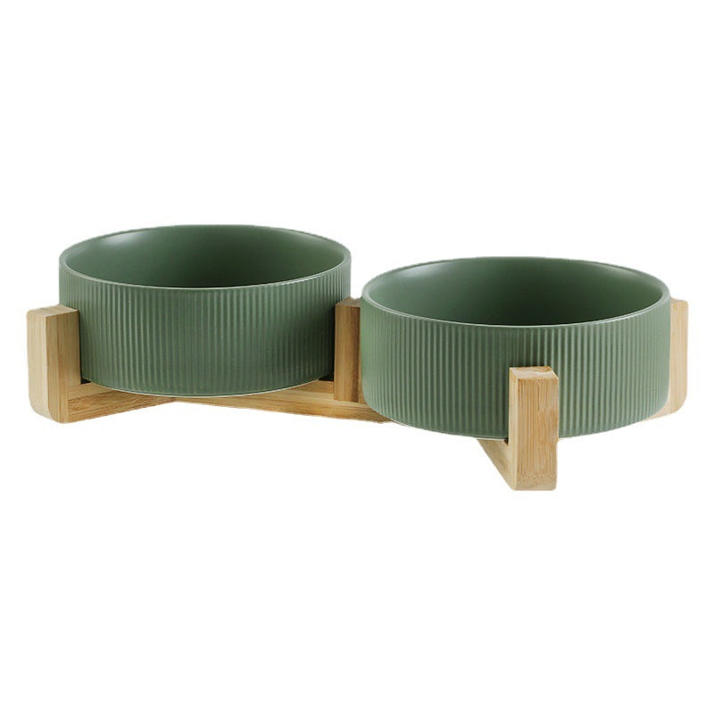 Close-up of a modern elevated pet feeder with dishwasher-safe ceramic bowls & wooden stand.