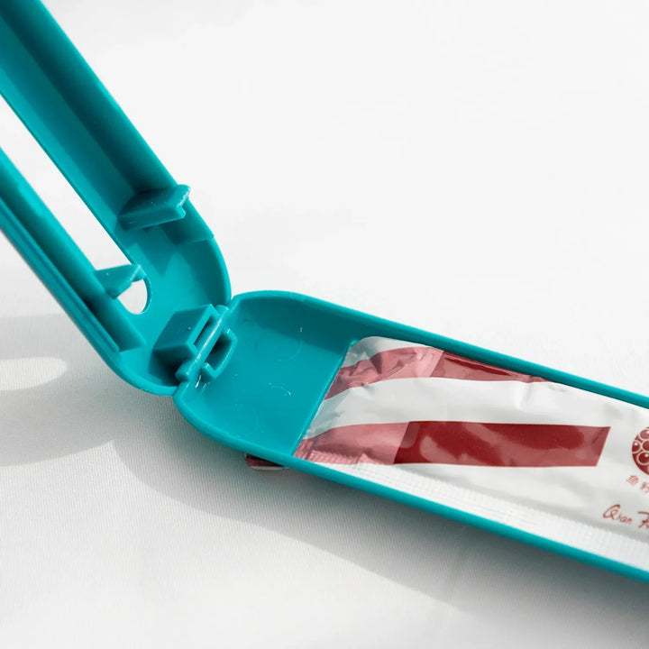 Pet feeding tool: a sleek wet food dispenser spoon with a slider for easy, hygienic feeding of cats & dogs.