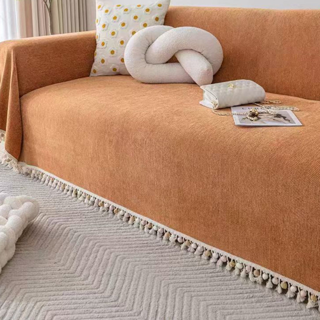 Decorative pet friendly herringbone couch throw with tassel fringe, a boho slipcover for your living room furniture.