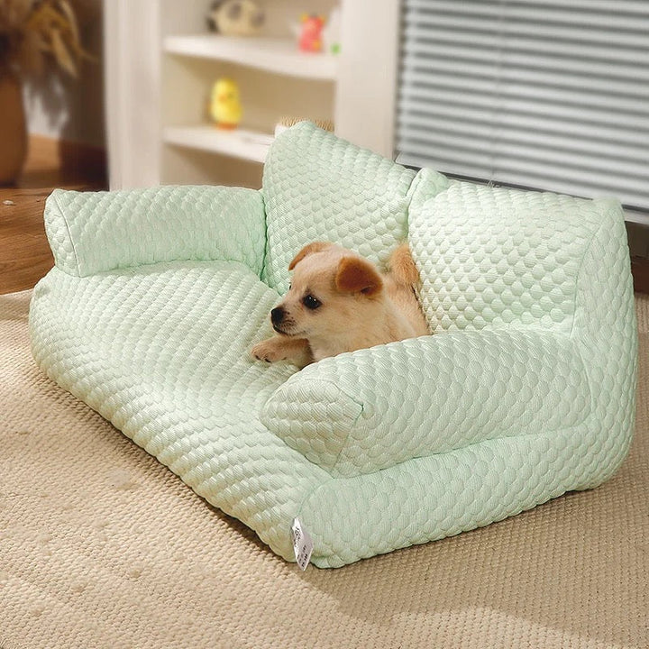 Breathable cooling dog sofa couch. Orthopedic pet bed with washable cover for summer relaxation.