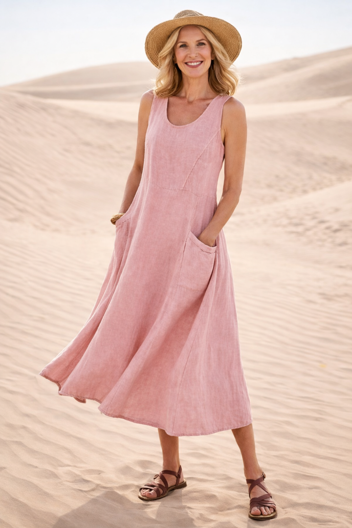 Pink A-line midi dress for women, sleeveless and flowy. Comfortable everyday style, perfect for summer.