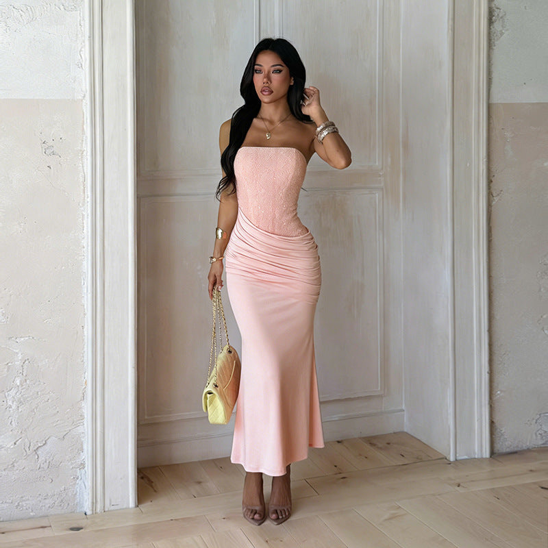 Women's pink strapless ruched maxi dress. Elegant formal occasion wear, ideal for wedding guests.