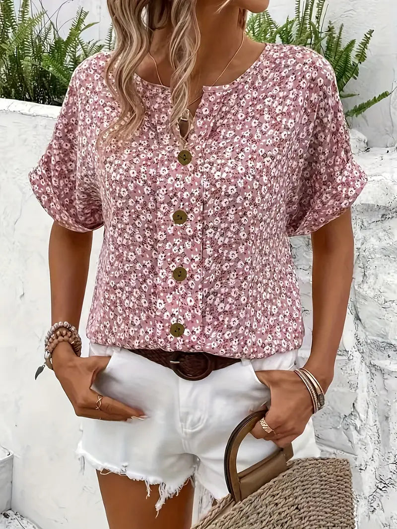 Stylish short-sleeve floral button-front blouse in pink. Comfortable everyday women's top.
