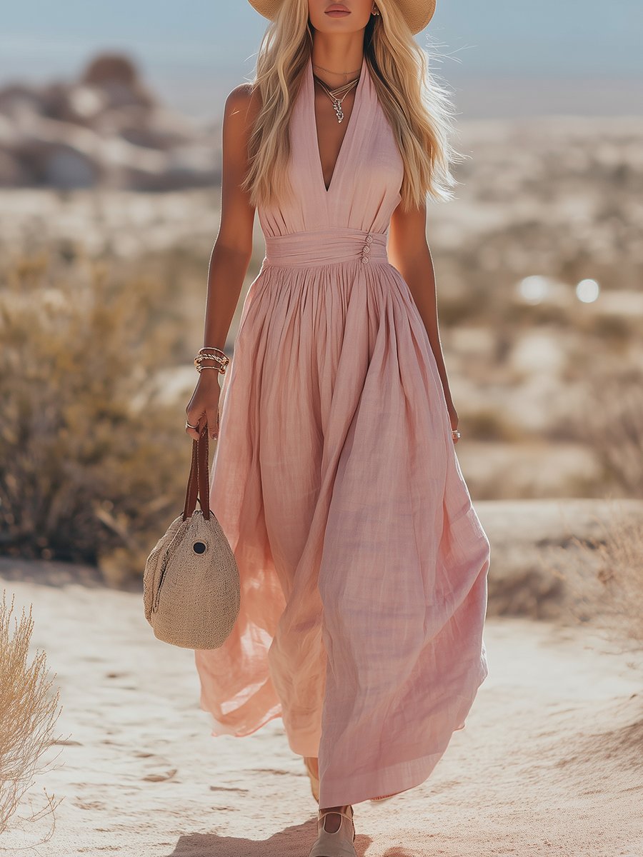 Pink flowing halterneck maxi dress for women. Ideal summer casual wear or vacation outfit.