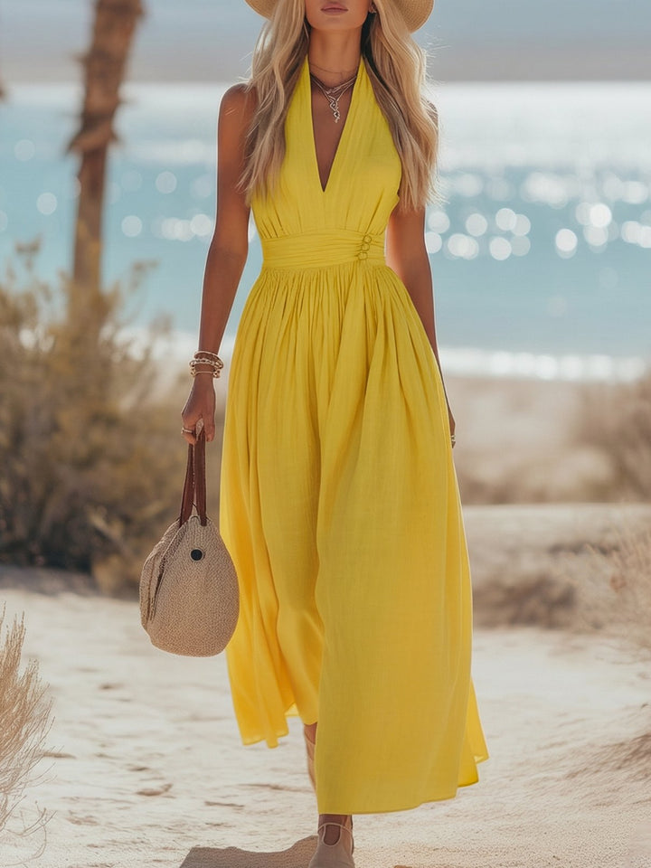 Yellow bohemian style halterneck maxi dress. Perfect women's summer casual or vacation outfit.