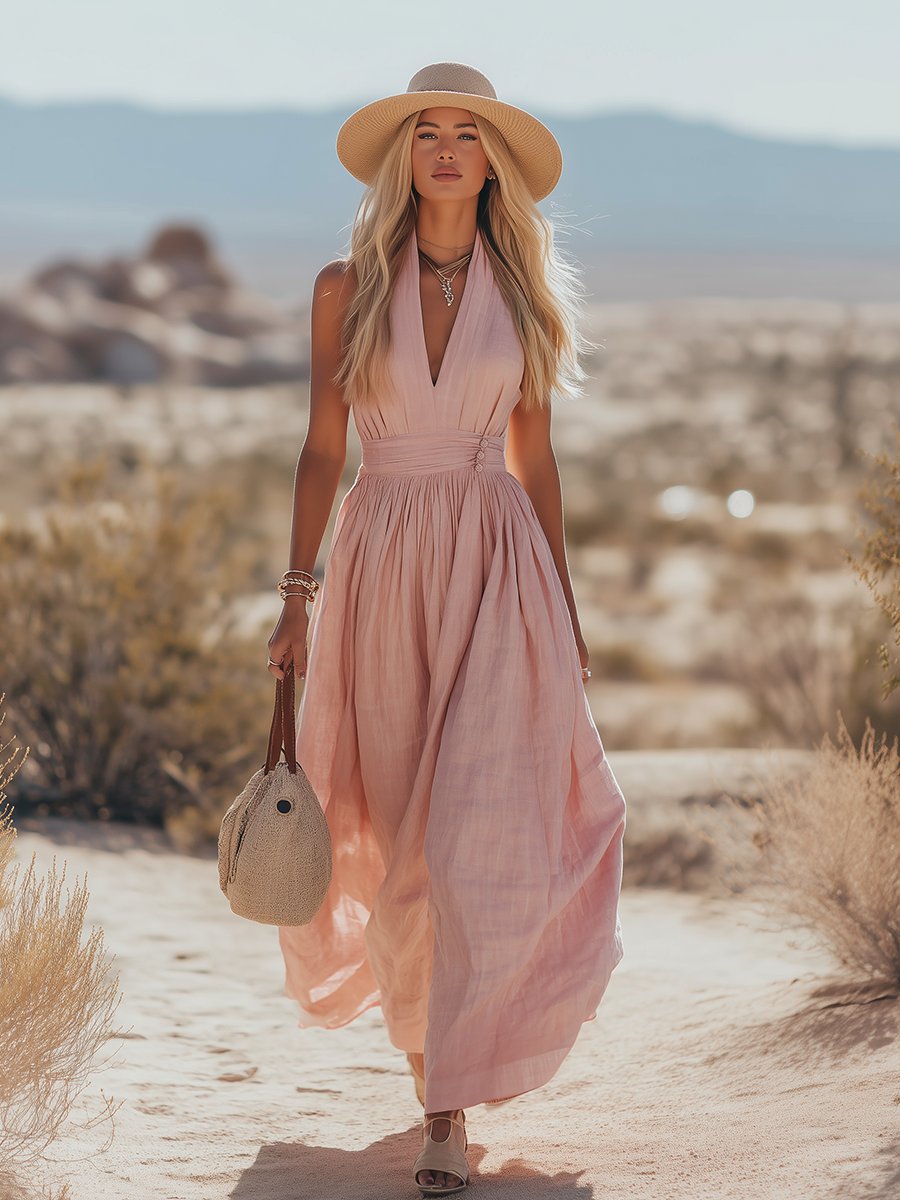 Sleeveless flowing halterneck maxi dress for women, pink. Comfortable summer casual wear.