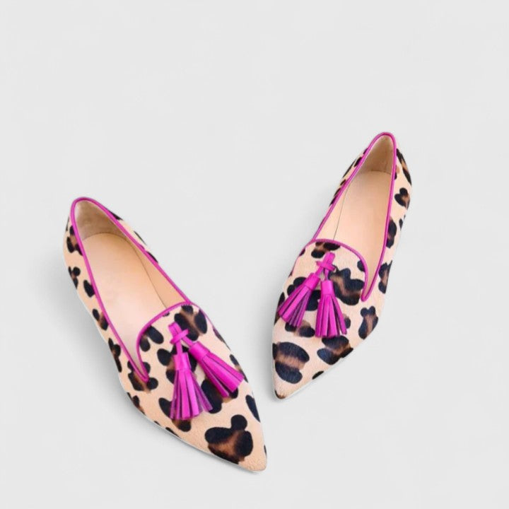 Pink patterned pointed toe women's loafers with tassel detail, comfortable flat slip-on shoes for casual wear.