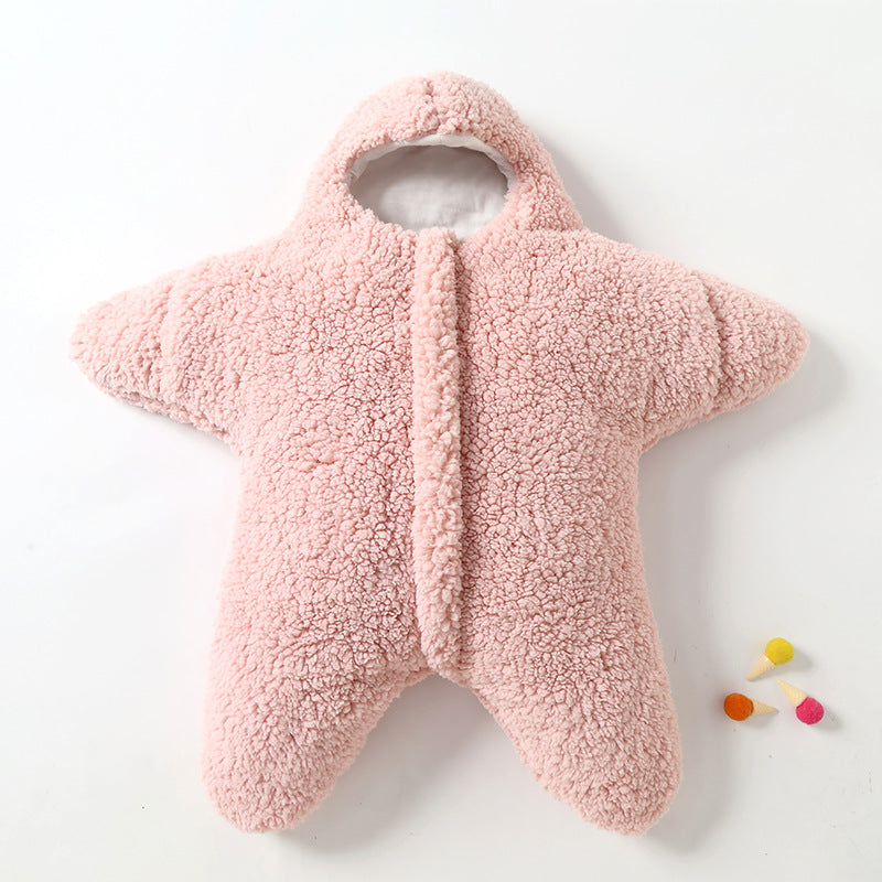 Close-up of a soft pink star baby sleeping bag, cozy infant sleep sack