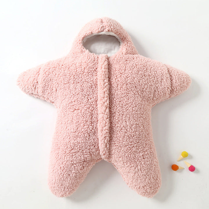 Close-up of a soft pink star baby sleeping bag, cozy infant sleep sack