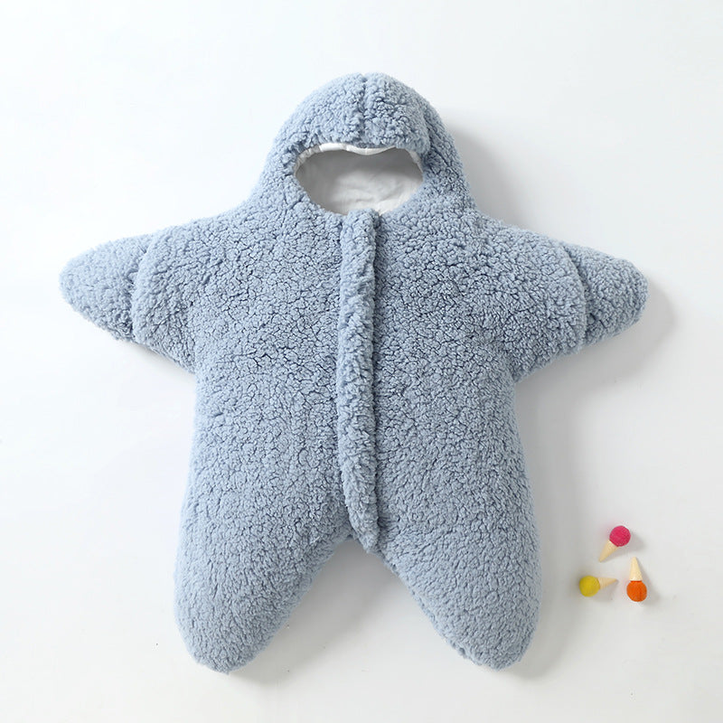 Adorable baby wearing a khaki star sleeping bag, perfect for cold nights