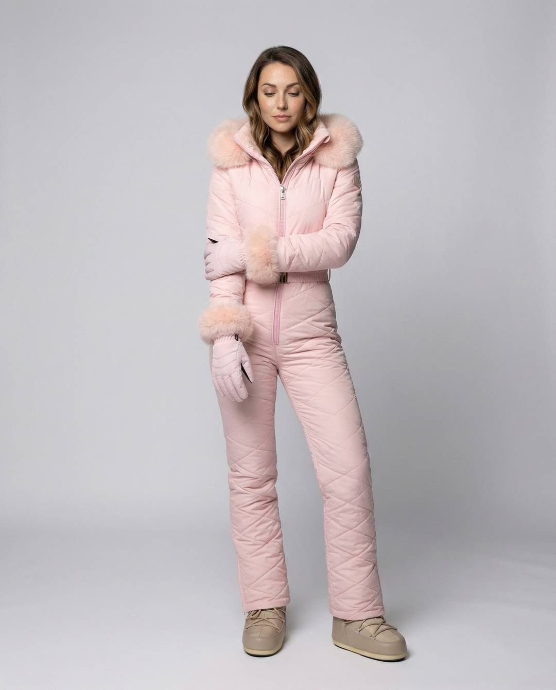 Pink women's weather-resistant snowboard overall with zipper detail
