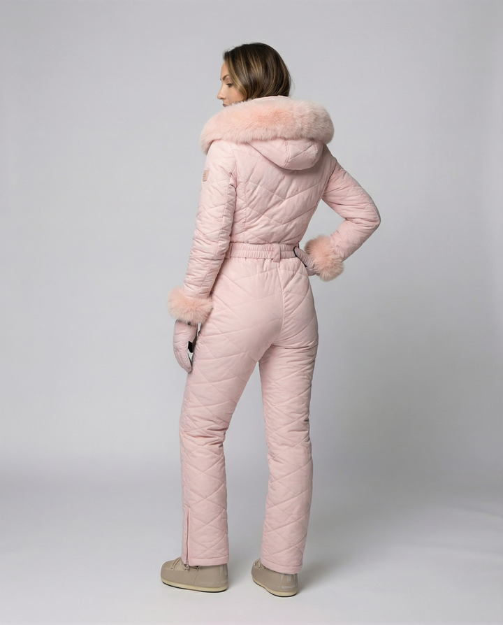 Close-up of the zipper on a women's pink snowboard overall