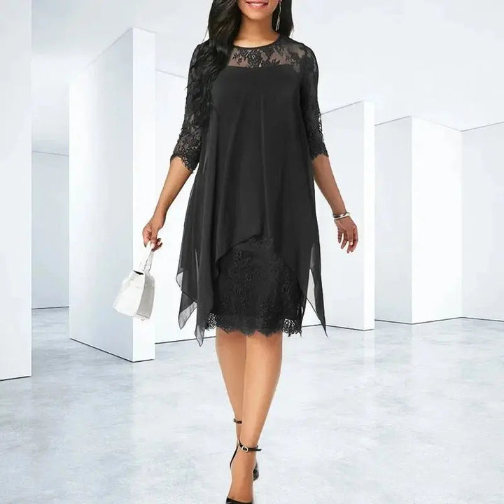 Comfortable plus size women's formal dress in chiffon, with quarter sleeves, lace, and flattering asymmetric hem.