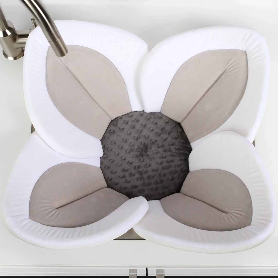 Newborn relaxing in the Blooming Bath Seat, a cozy and safe bathing experience