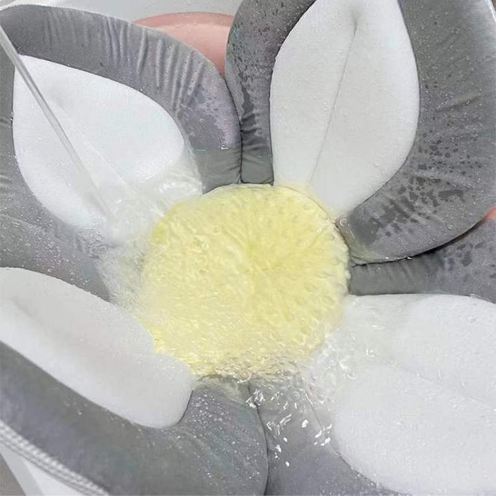 A cute, plush flower bath seat ensuring safe bathing for babies in any sink