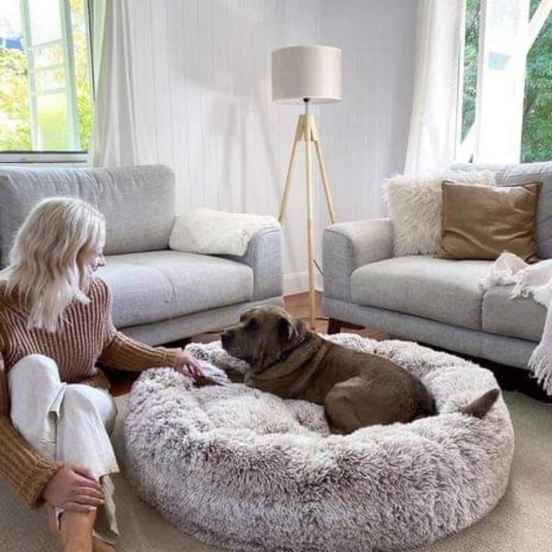 Luxurious faux fur donut dog bed, specifically designed to relieve anxiety and provide superior pet comfort.