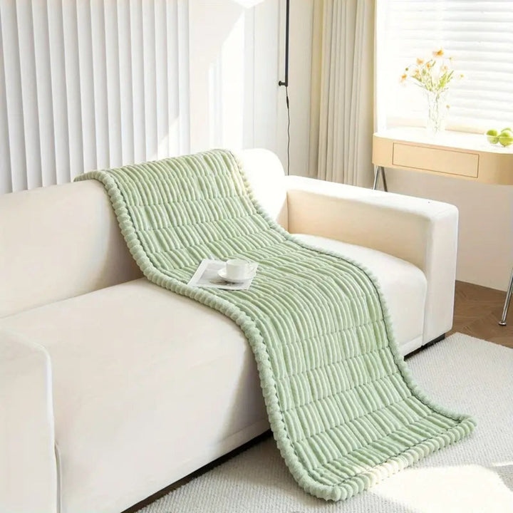 Enhance living room decor with this cozy plush fleece sofa protector, non-slip & washable.
