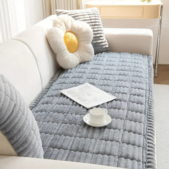 Pet-friendly plush fleece sofa protector mat, non-slip, keeps furniture clean & cozy.
